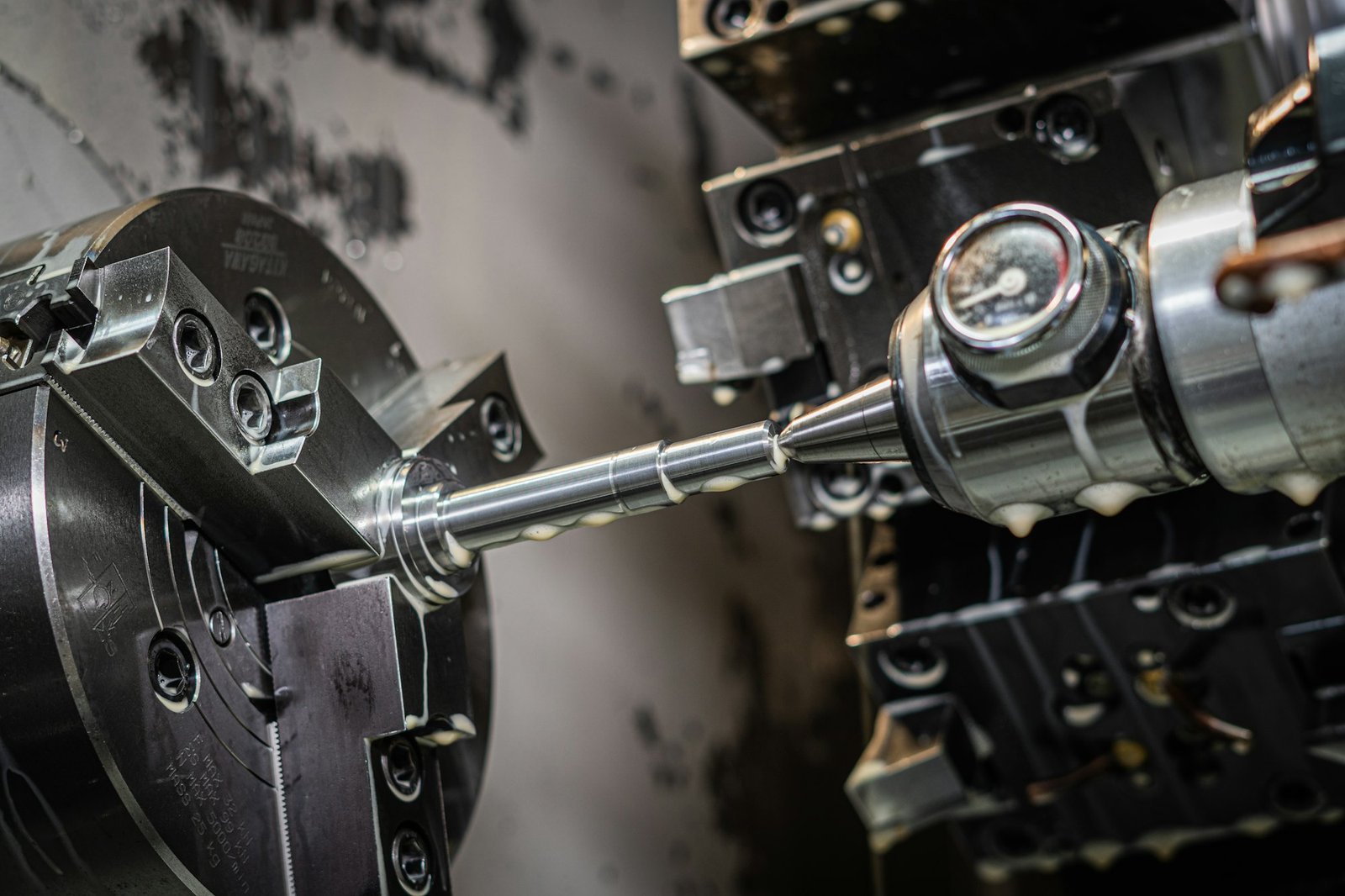 CNC lathe turning a steel shaft